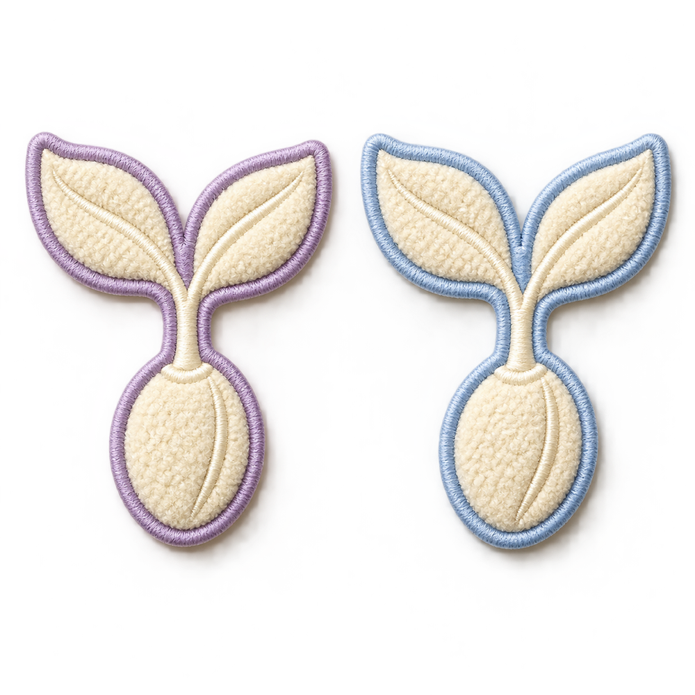 Seed and sprout emblem patches in lavender and powder blue