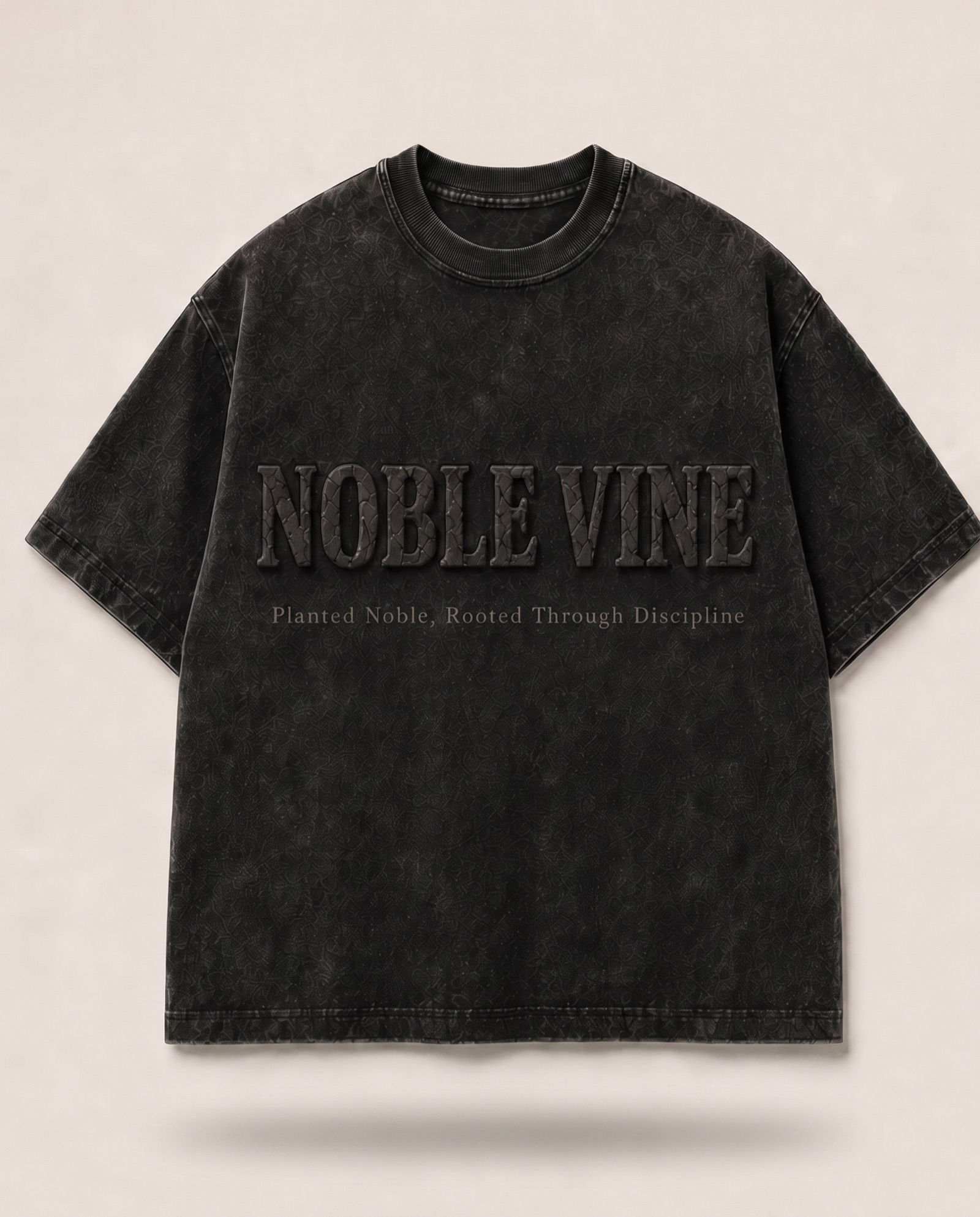 The Black Nobility Tee in Vintage Black with embossed chest lettering